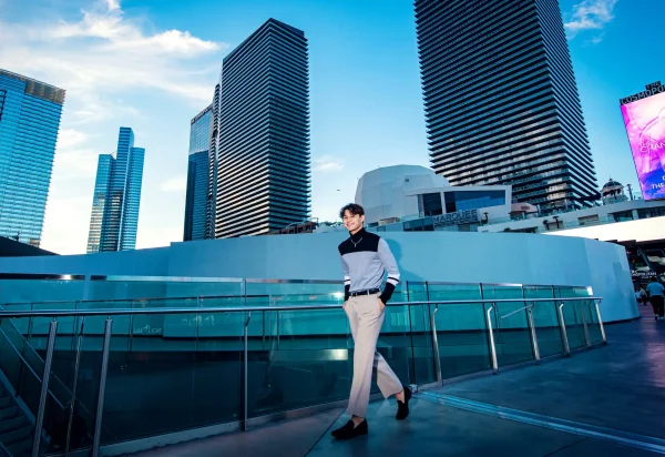Las Vegas Strip senior portraits senior guy walking at CityCenter Las Vegas with modern skyline in the background