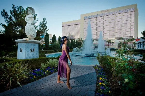 Las Vegas Strip senior portraits senior dancer posing near the Caesars Palace fountain in a purple dress