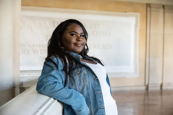 Las Vegas Strip senior portraits senior girl in a jean jacket posing indoors at Bellagio