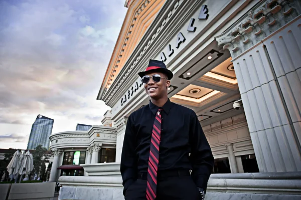 Las Vegas Strip senior portraits senior guy wearing sunglasses and a tie posing outside Caesars Palace