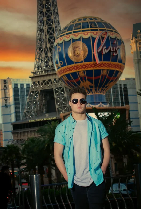 sunglasses senior guy with paris las vegas background